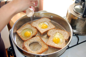 making_eggs_in_basket-300x199